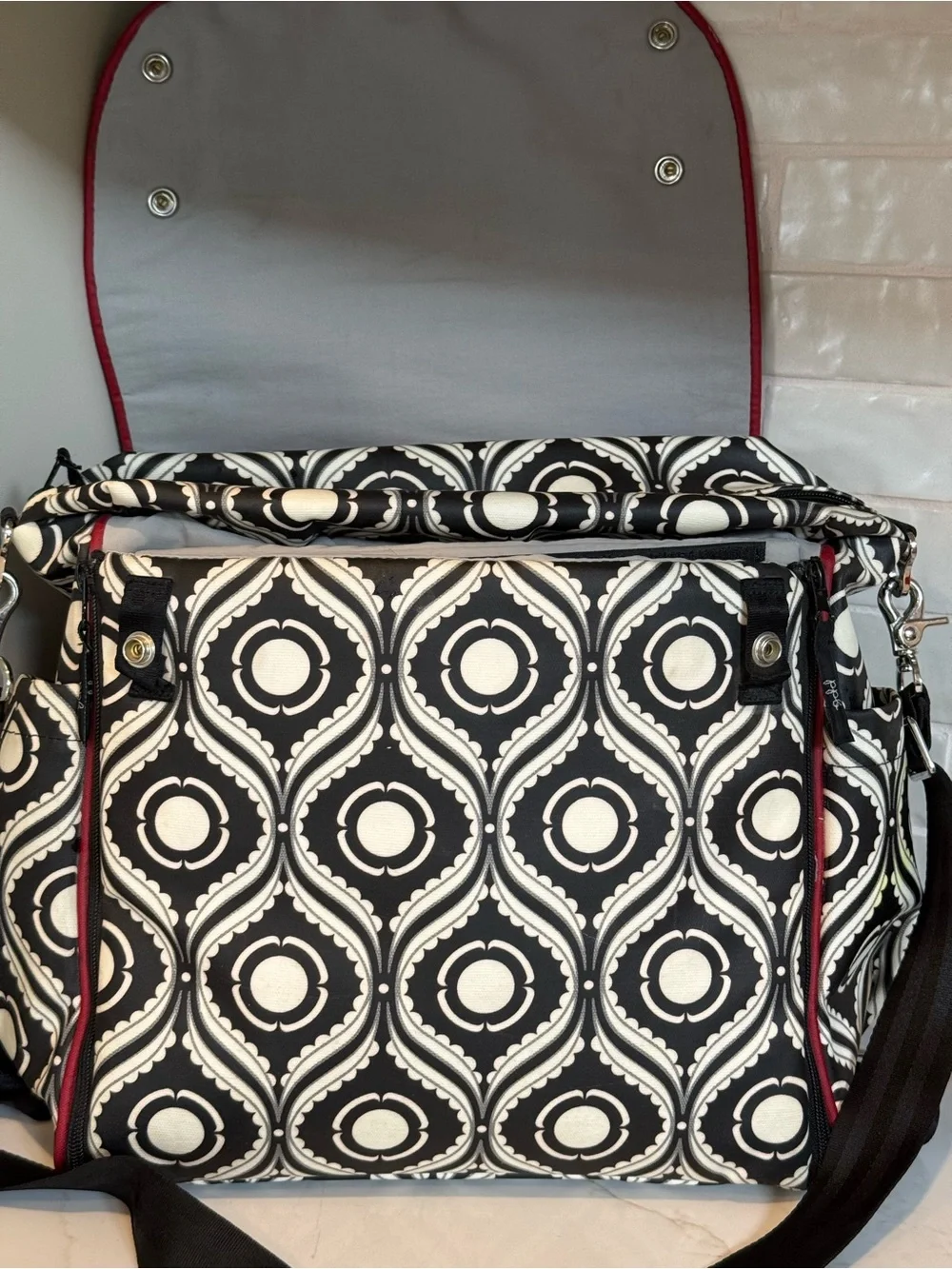 Petunia Pickle Bottom Black & White Geometric Baby Bag with Red Accent